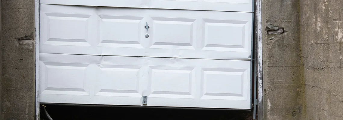 Garage Door Got Hit By A Car Dent Removal in Ormond Beach